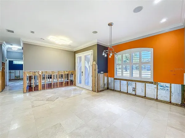 a view of swimming pool with a lounge chairs