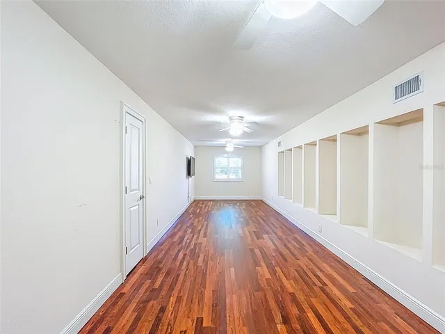 a view of a porch with chairs in patio