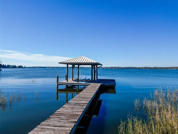 a bathroom with a toilet sink and shower