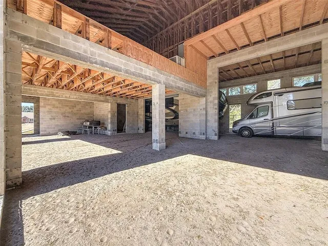 a spacious bathroom with a sink a toilet and a large mirror