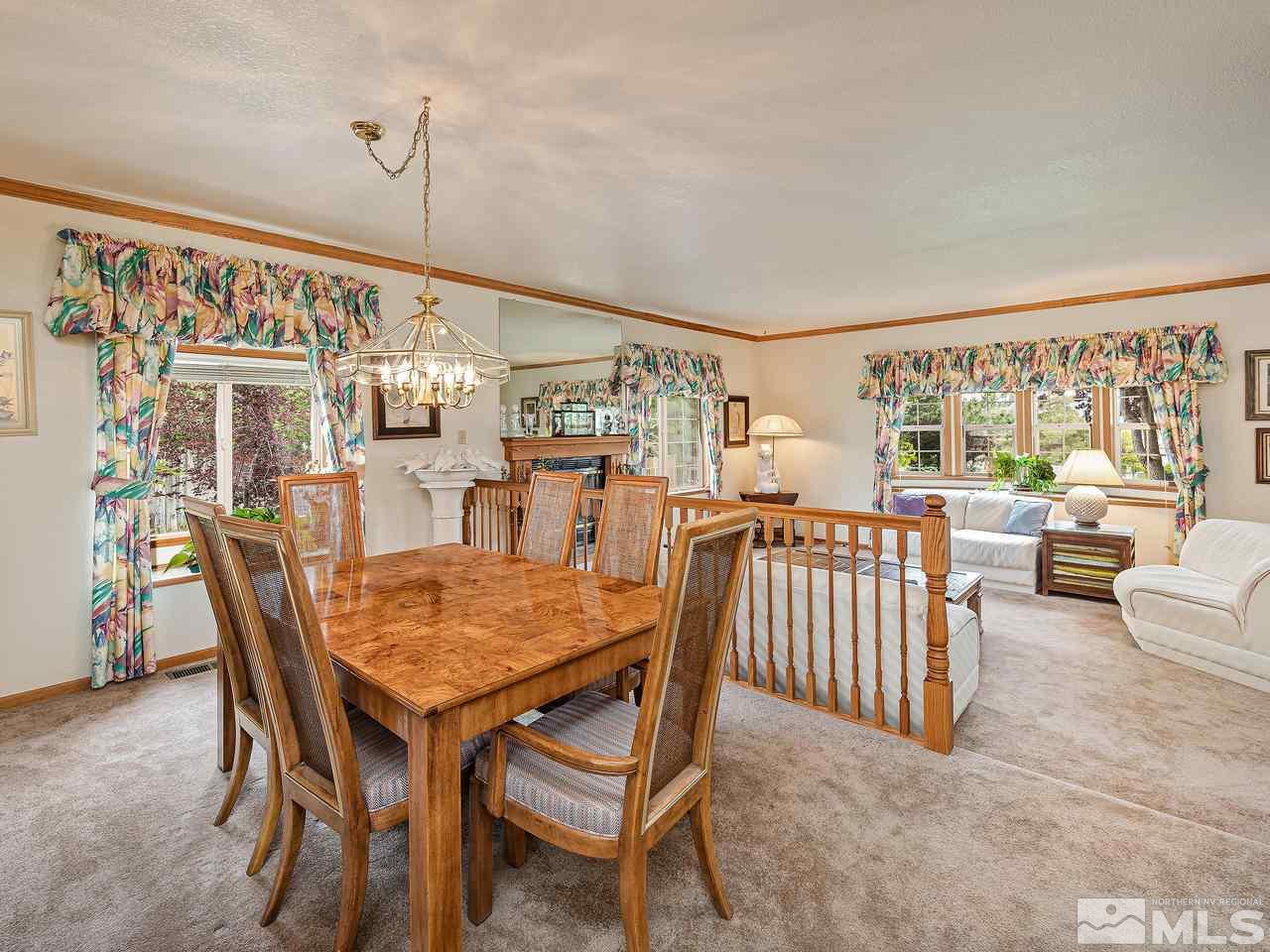 35 Calla Lily Court Reno, NV 89511 - Photo 11 of 39 a dining room with furniture and wooden floor