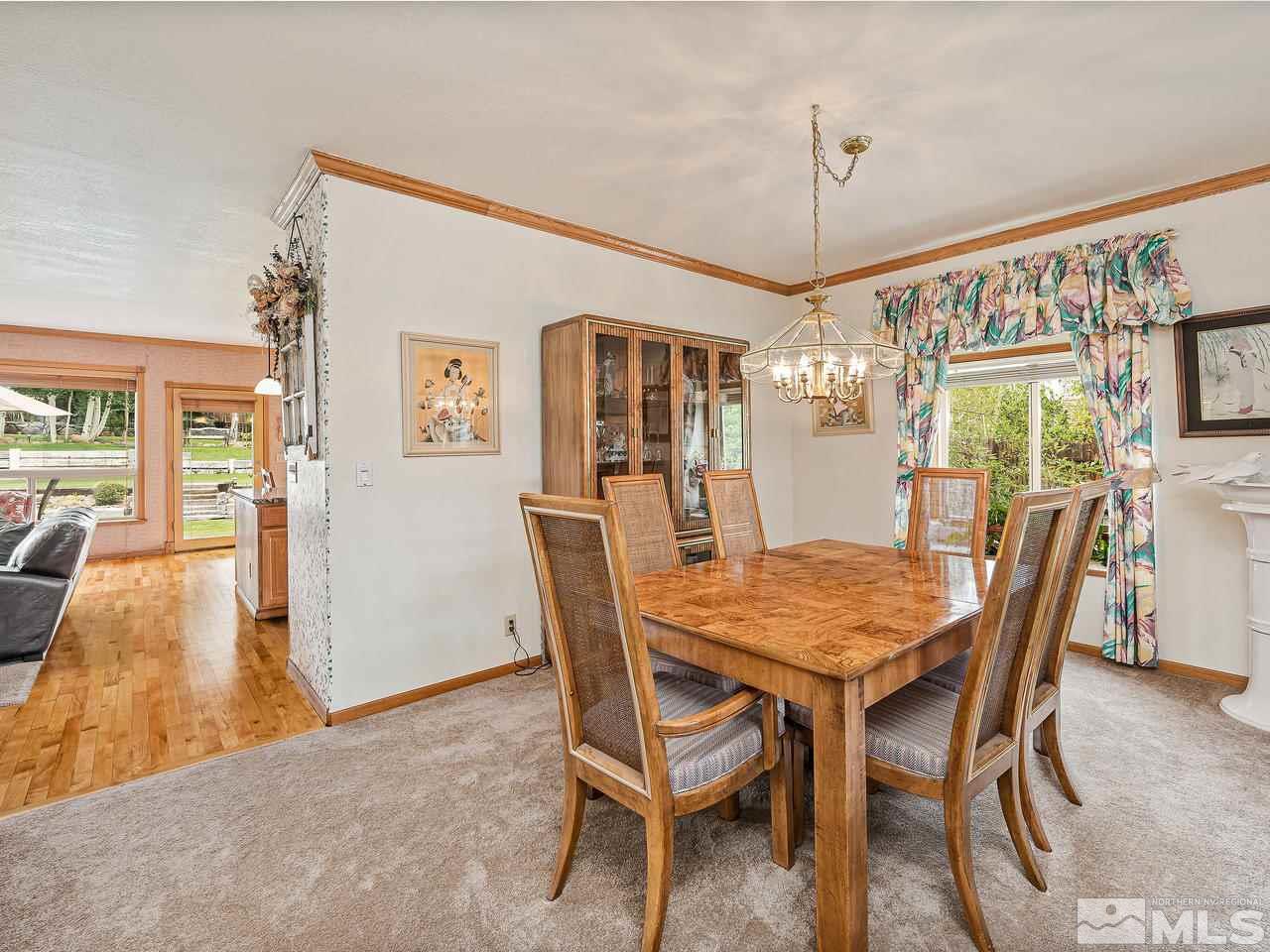 35 Calla Lily Court Reno, NV 89511 - Photo 12 of 39 a view of a dining room with furniture and wooden floor