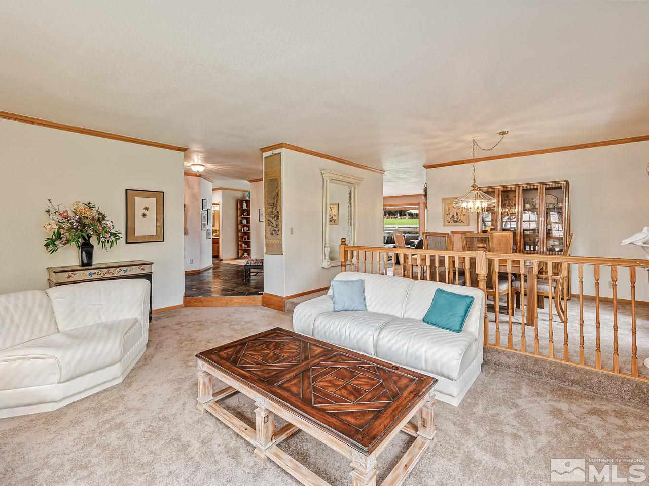 35 Calla Lily Court Reno, NV 89511 - Photo 13 of 39 a living room with furniture and a wooden floor