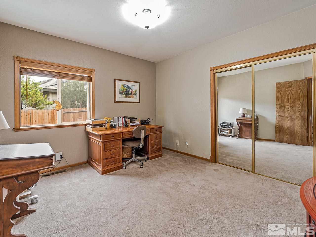 35 Calla Lily Court Reno, NV 89511 - Photo 19 of 39 a view of a livingroom with workspace and a window