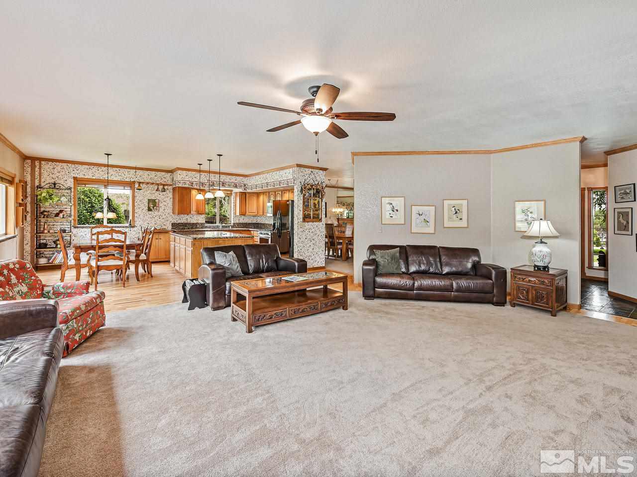 35 Calla Lily Court Reno, NV 89511 - Photo 9 of 39 a living room with furniture and a chandelier