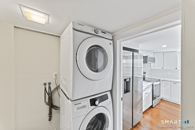 3 Riverside Road, Unit B Newtown, CT 06482 - Photo 20 of 20 a view of a hallway with washer and dryer