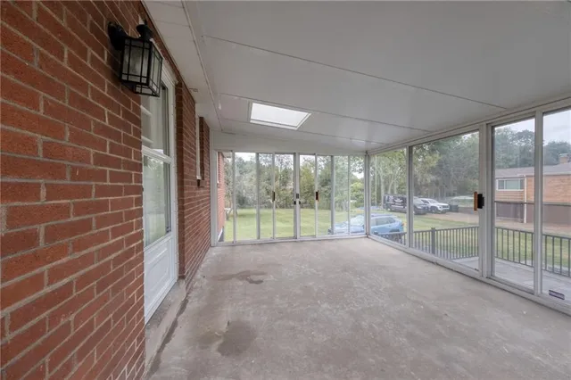 a view of a room with a large window