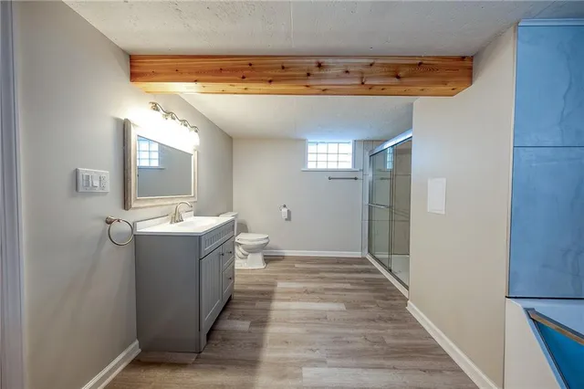 a view of a bathroom with a sink and mirror