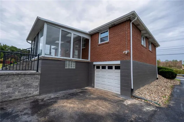 a front view of a house with a garage