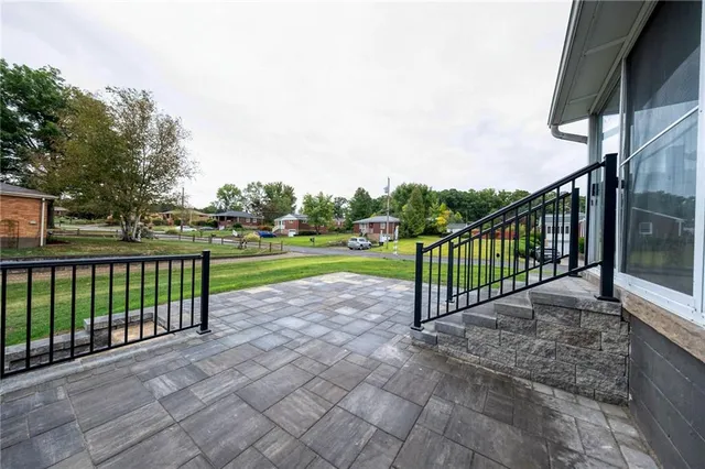 a view of a park with a large trees