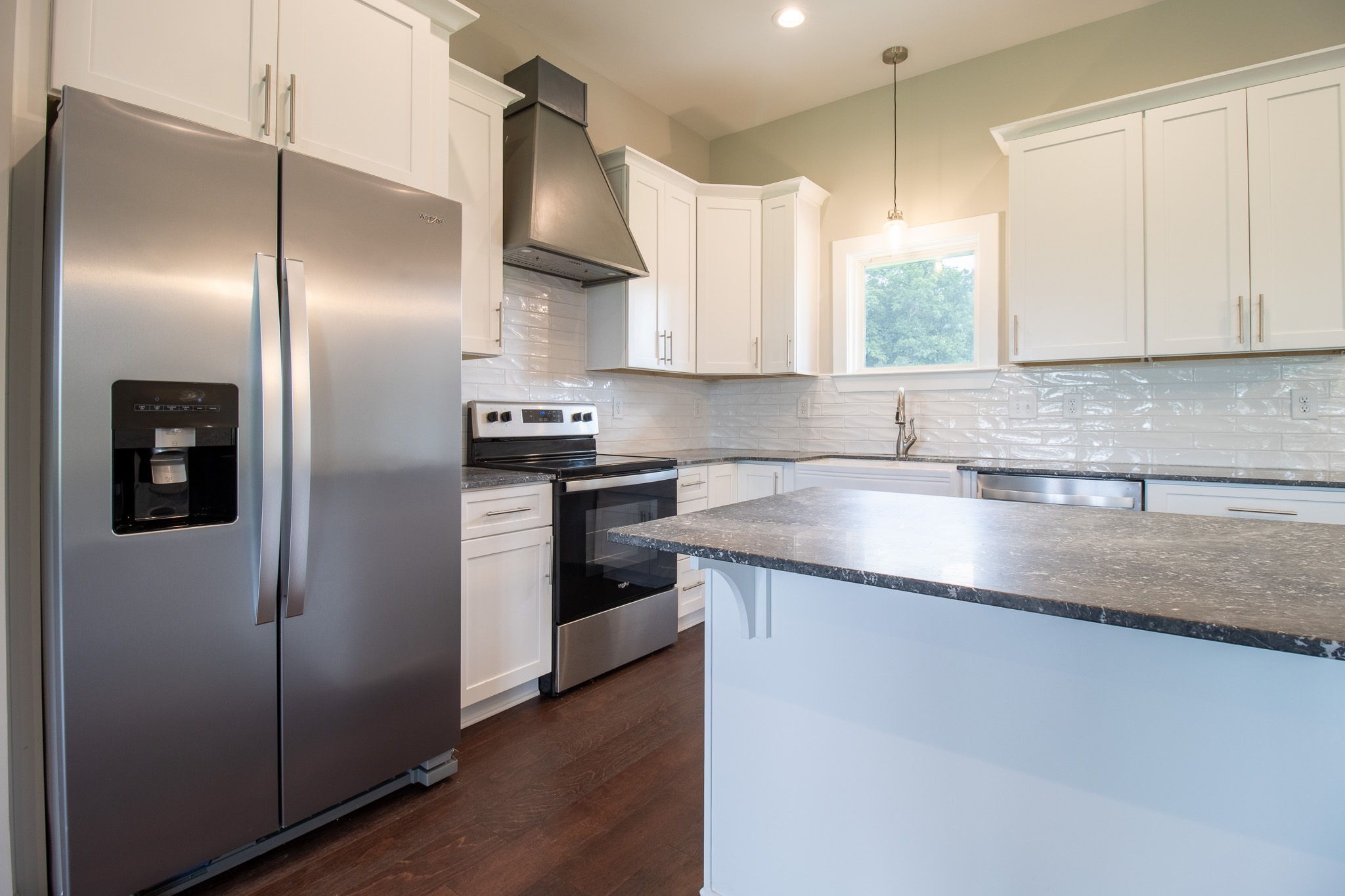 264 Dink Rut Road Portland, TN 37148 - Photo 19 of 56 a kitchen with stainless steel appliances granite countertop a refrigerator a sink a stove and white cabinets