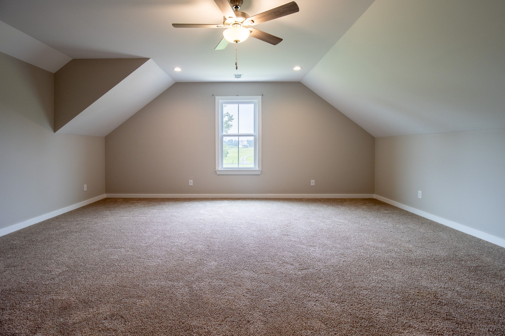 264 Dink Rut Road Portland, TN 37148 - Photo 44 of 56 an empty room with a chandelier fan and windows
