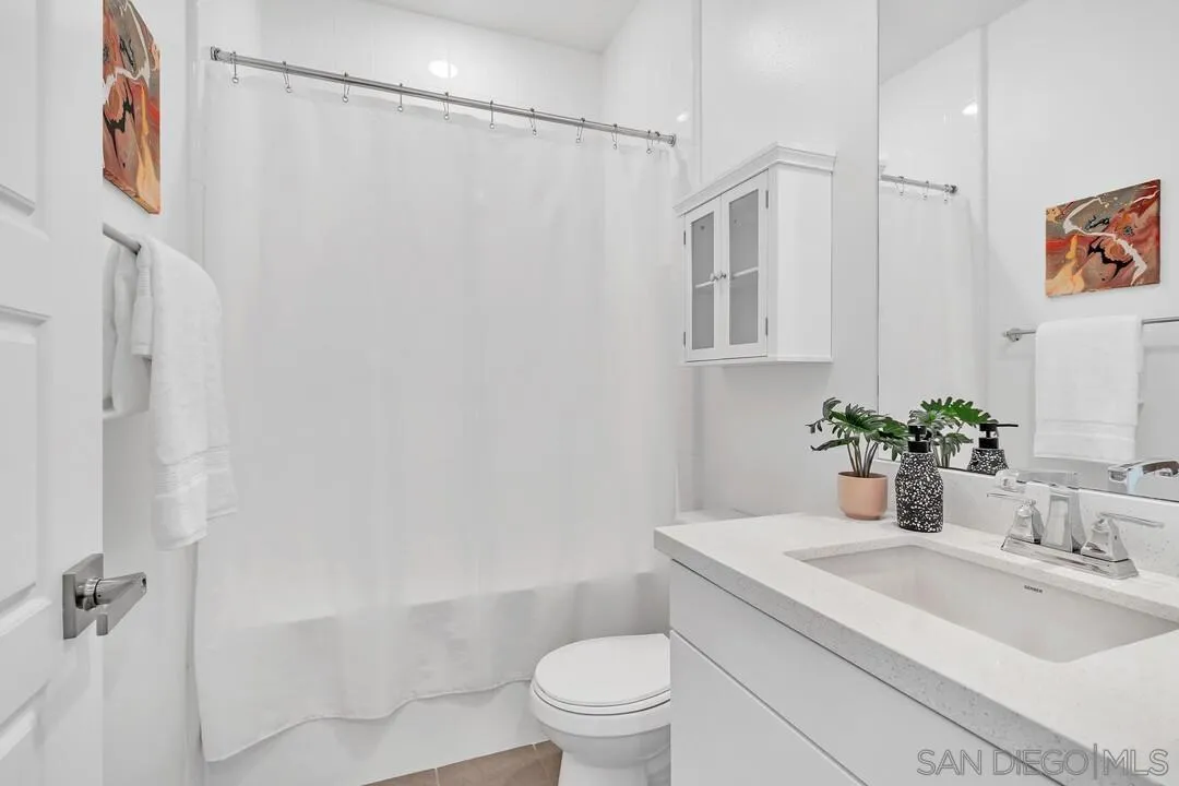 9041 West Bluff Place Santee, CA 92071 - Photo 23 of 42 a bathroom with a sink a toilet and shower