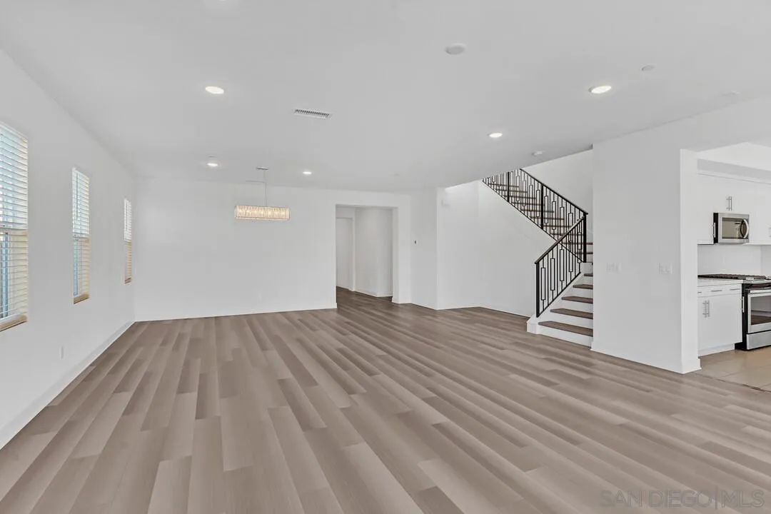 9041 West Bluff Place Santee, CA 92071 - Photo 10 of 42 a view of empty room with wooden floor