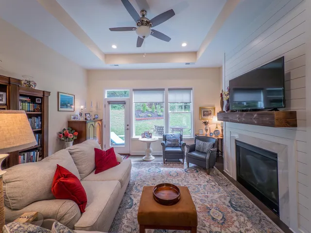 a living room with furniture and a fireplace