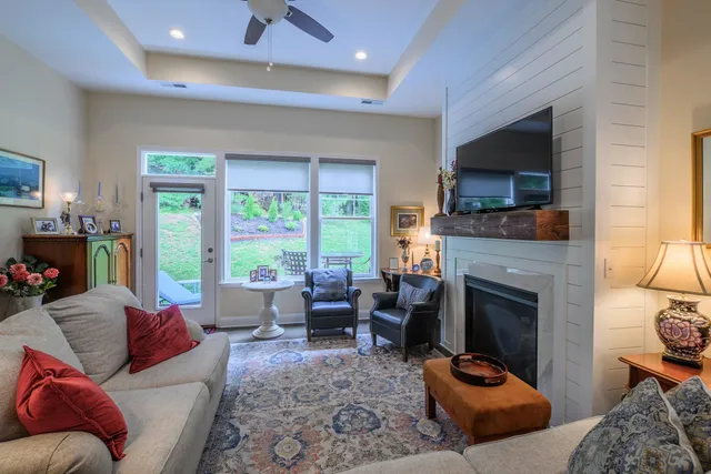 a living room with furniture flat screen tv and a fireplace