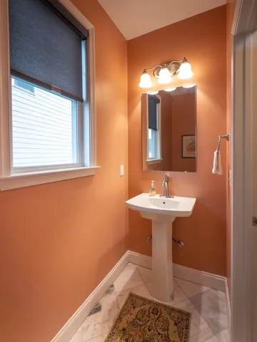 a bathroom with a sink mirror and a vanity