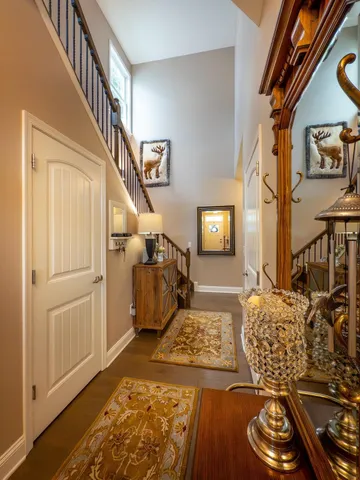 a kitchen with stainless steel appliances granite countertop a sink a stove a refrigerator and island