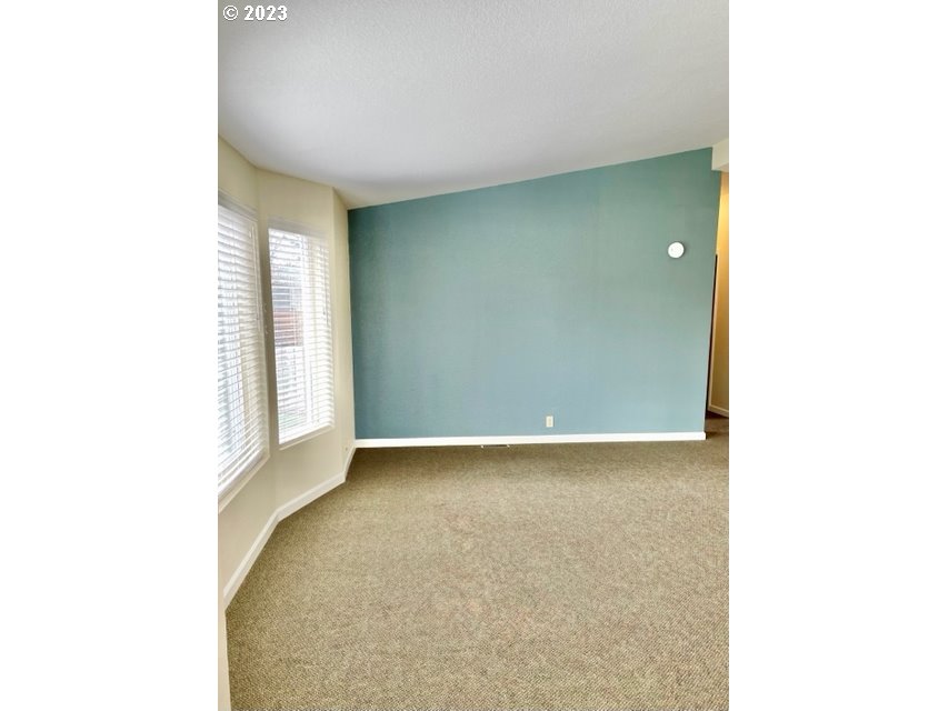 3355 North Delta Road Eugene, OR 97408 - Photo 5 of 15 a view of an empty room with a window