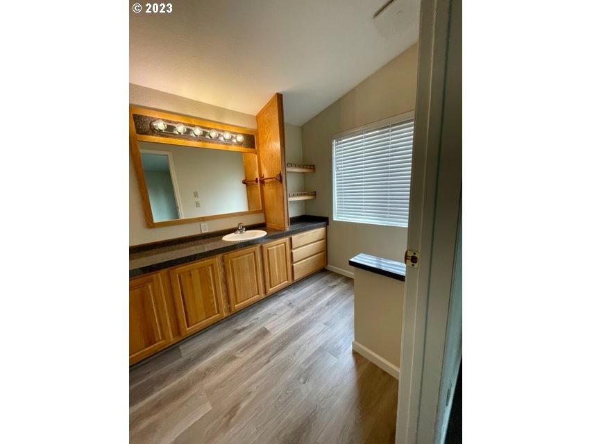 3355 North Delta Road Eugene, OR 97408 - Photo 9 of 15 a view of a living room with wooden floor