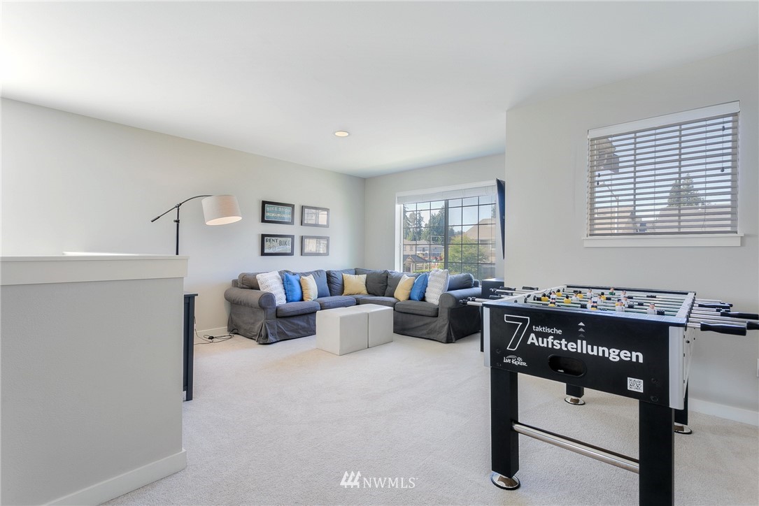 3922 216th Place Southeast Bothell, WA 98021 - Photo 14 of 33 a living room with furniture a rug and a window