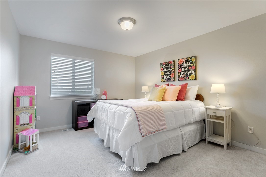 3922 216th Place Southeast Bothell, WA 98021 - Photo 22 of 33 a bedroom with a bed and a table