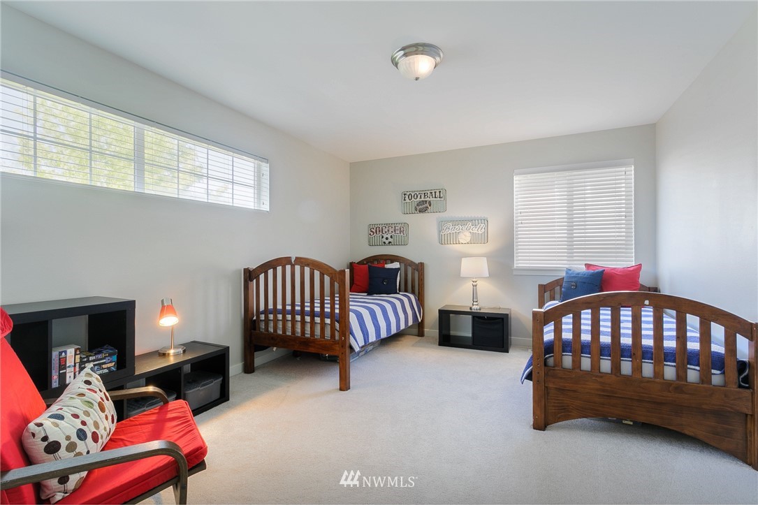 3922 216th Place Southeast Bothell, WA 98021 - Photo 23 of 33 a bedroom with furniture and a window