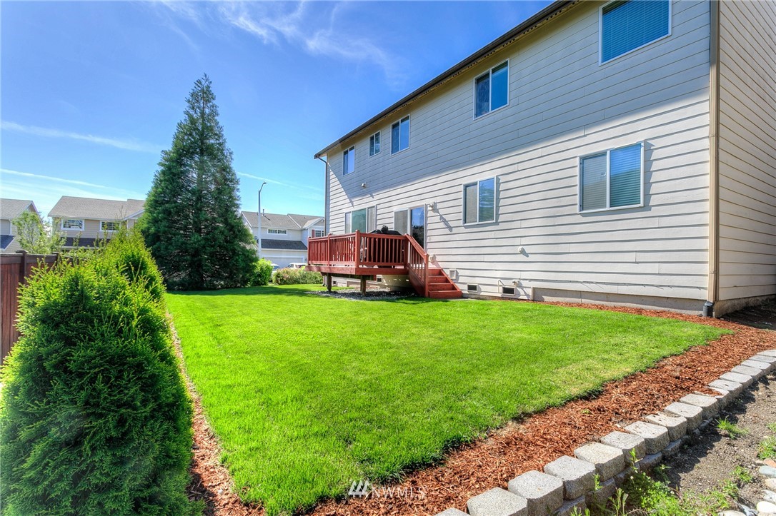3922 216th Place Southeast Bothell, WA 98021 - Photo 29 of 33 a front view of a house with a yard
