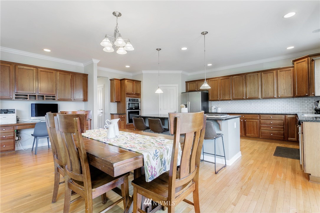 3922 216th Place Southeast Bothell, WA 98021 - Photo 4 of 33 a view of a dining room with furniture and wooden floor