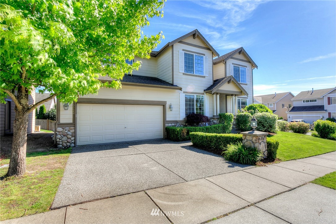 3922 216th Place Southeast Bothell, WA 98021 - Photo 33 of 33 a front view of a house with a yard