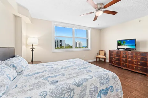 a bedroom with a bed and a desk