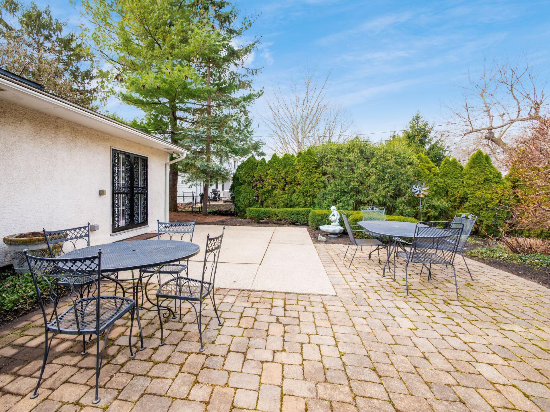 880 Lynbrook Road Columbus, OH 43235 - Photo 4 of 59 Back Concrete and paver patios