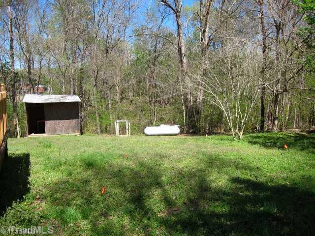 3733 Bason Road Mebane, NC 27302 - Photo 15 of 16 Yard/Garden. Shed. Propane tank leased from Foust Fuel in Mebane.
