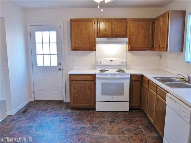3733 Bason Road Mebane, NC 27302 - Photo 7 of 16 Kitchen. Door to small side porch entry/driveway.