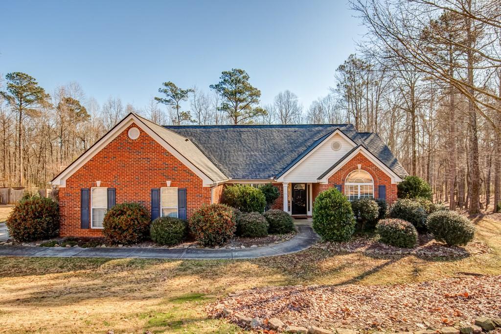370 Lexington Circle Athens, GA 30605 - Photo 1 of 1 a front view of a house with a yard and garage