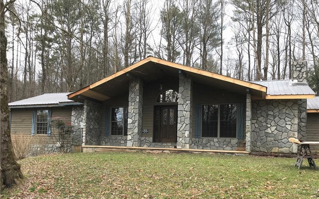 7551 Boardtown Road Ellijay, GA 30540 - Photo 1 of 1 a front view of a house with garden
