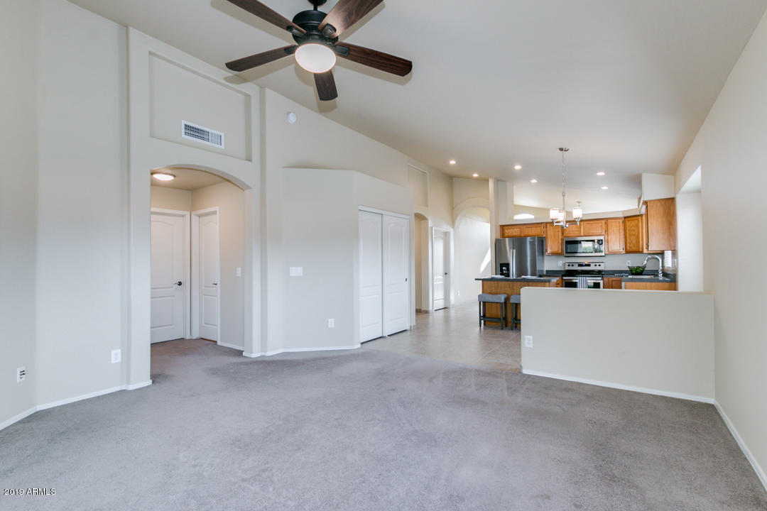 7292 South Roberts Road Tempe, AZ 85283 - Photo 3 of 38 a view of a kitchen with a sink and a refrigerator