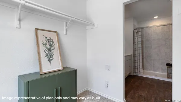 a view of bathroom with shower and hardwood floor