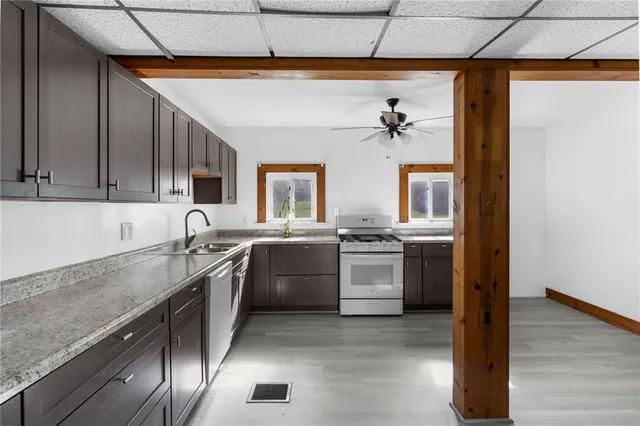a kitchen with a sink cabinets and appliances