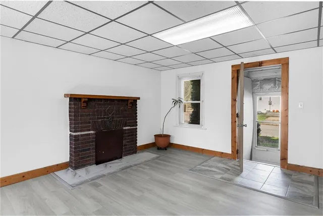 a view of an empty room with a fireplace