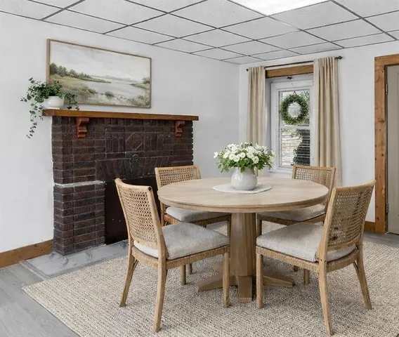 a dining room with furniture and window
