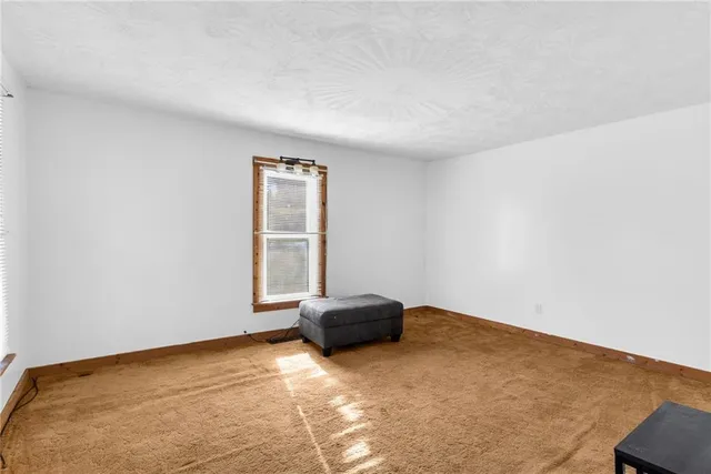 a view of room with a window and closet