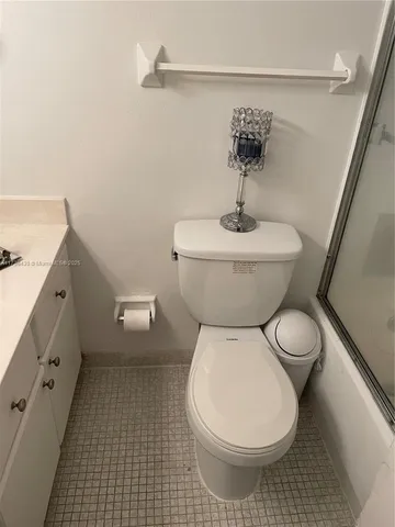 a kitchen with cabinets appliances a sink a stove and a window