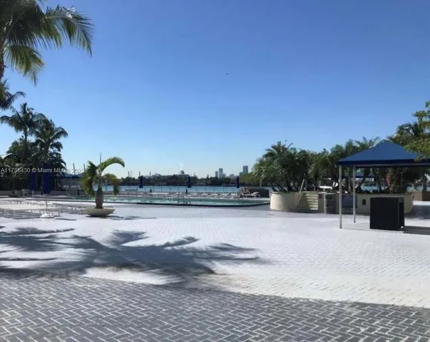 a view of swimming pool with a yard