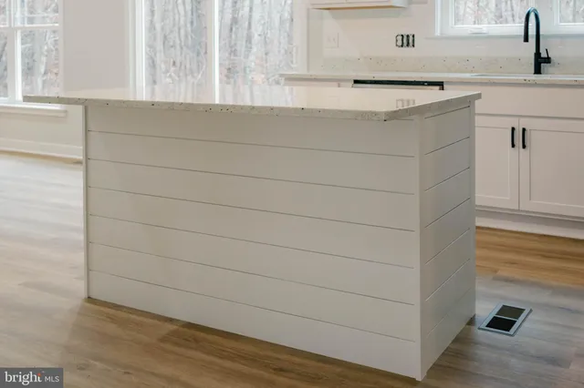 a bathroom with a sink and a window