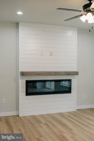 a view of wooden floor and a living room