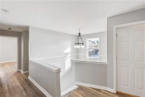 a bathroom with a shower and a mirror