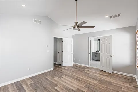 a bathroom with a bathtub sink and mirror