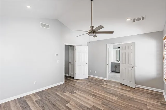 a bathroom with a bathtub sink and mirror