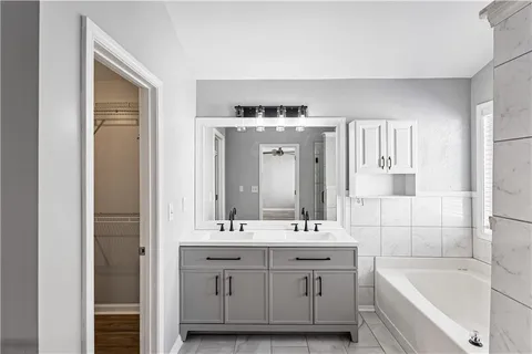 a bathroom with a bathtub and a shower